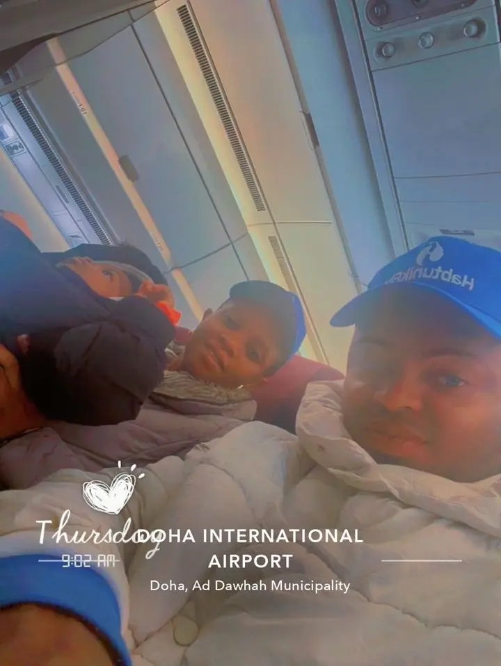 Clients taking a group selfie on board at Doha International Airport