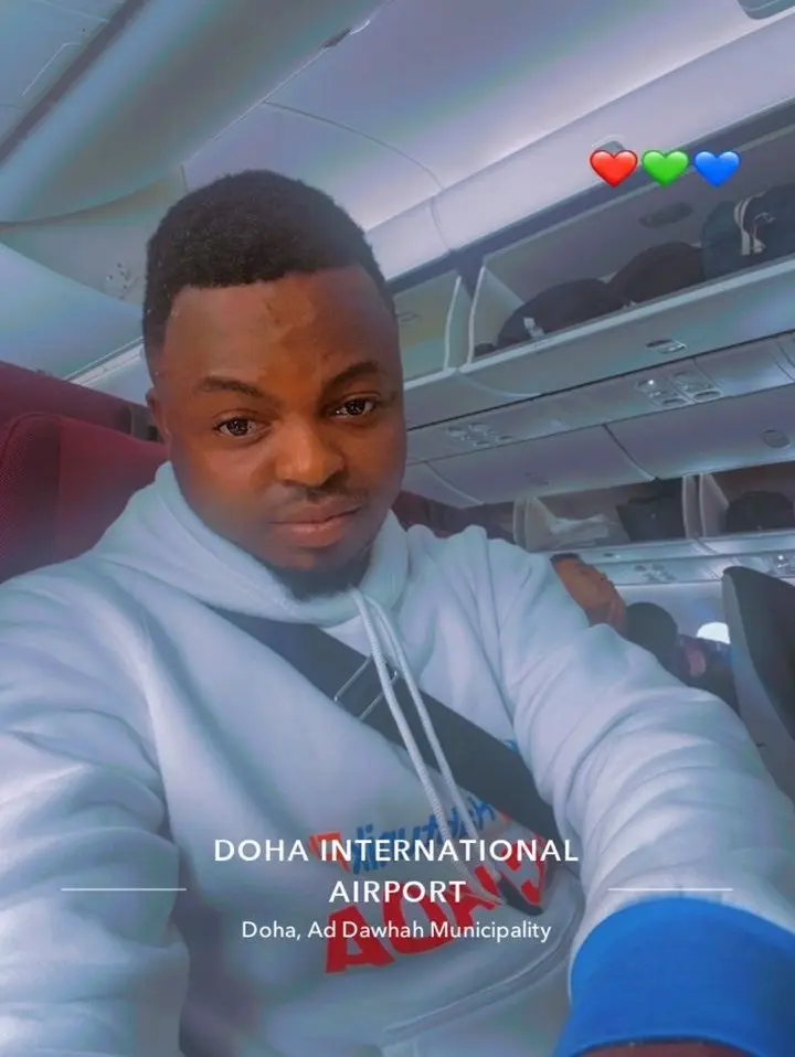 Client in a HabtunikFly Canada hoodie taking a selfie on the plane at Doha International Airport
