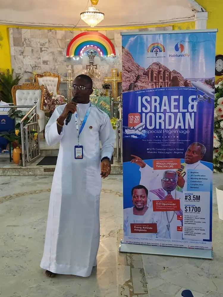 Minister speaking beside the Israel & Jordan Special Pilgrimage banner, 12–20 February 2027